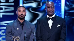 Michael B. Jordan and Delroy Lindo present the Special Visual Effects Award on stage during the EE BAFTA Film Awards 2026 at The Royal Festival Hall on February 22, 2026 in London, England.
