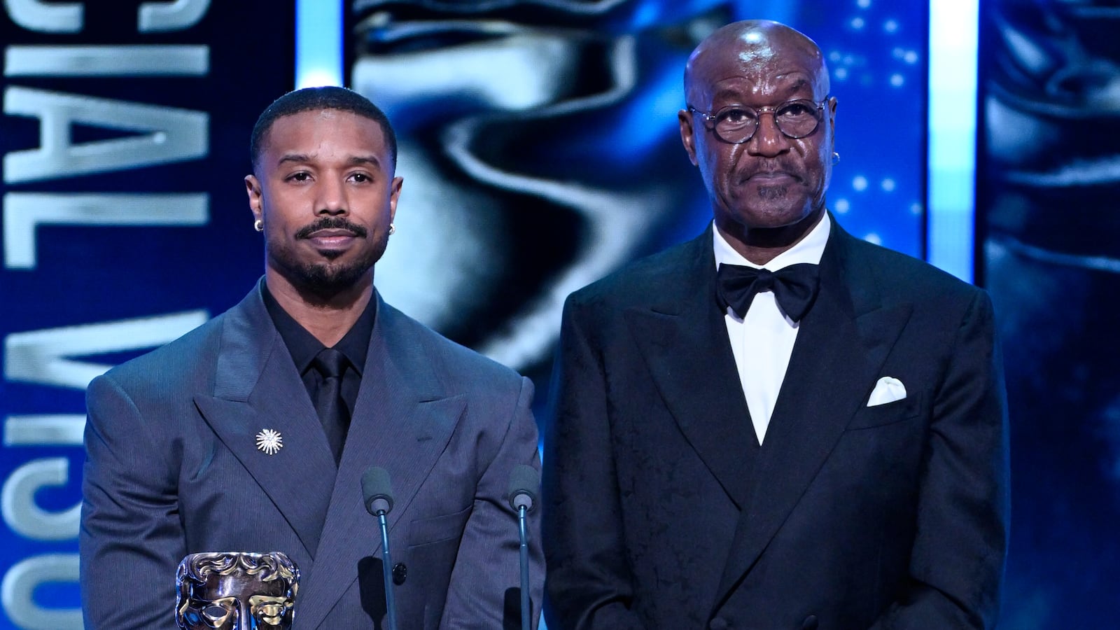 Michael B. Jordan and Delroy Lindo present the Special Visual Effects Award on stage during the EE BAFTA Film Awards 2026 at The Royal Festival Hall on February 22, 2026 in London, England.