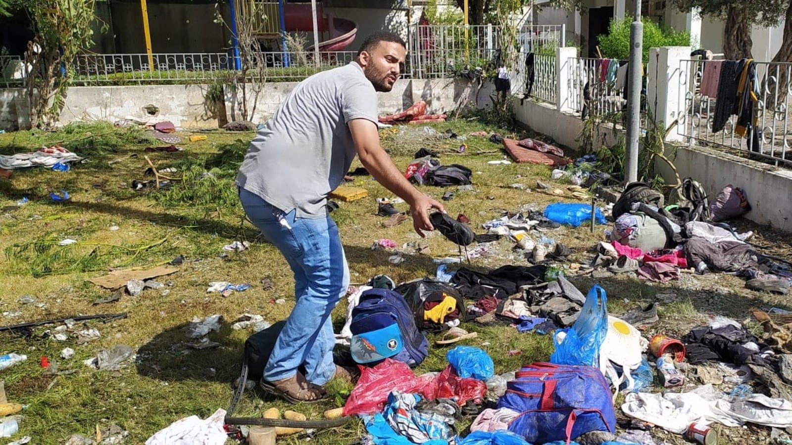 Survivors search through the debris of the hospital explosion.