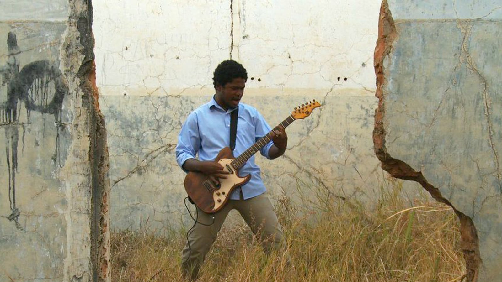 articles/2013/11/15/death-metal-angola-heavy-metal-in-wartorn-africa/131114-strochlic-death-metal-NEW_msprxb