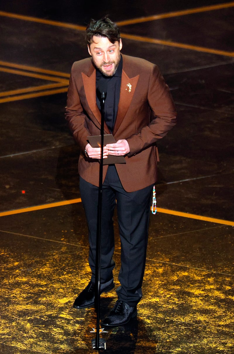 Kieran Culkin accepts the award for Sean Penn who won the Oscar for Best Supporting Actor for "One Battle after Another" during the Oscars show at the 98th Academy Awards in Hollywood, Los Angeles, California, U.S., March 15, 2026. REUTERS/Mike Blake