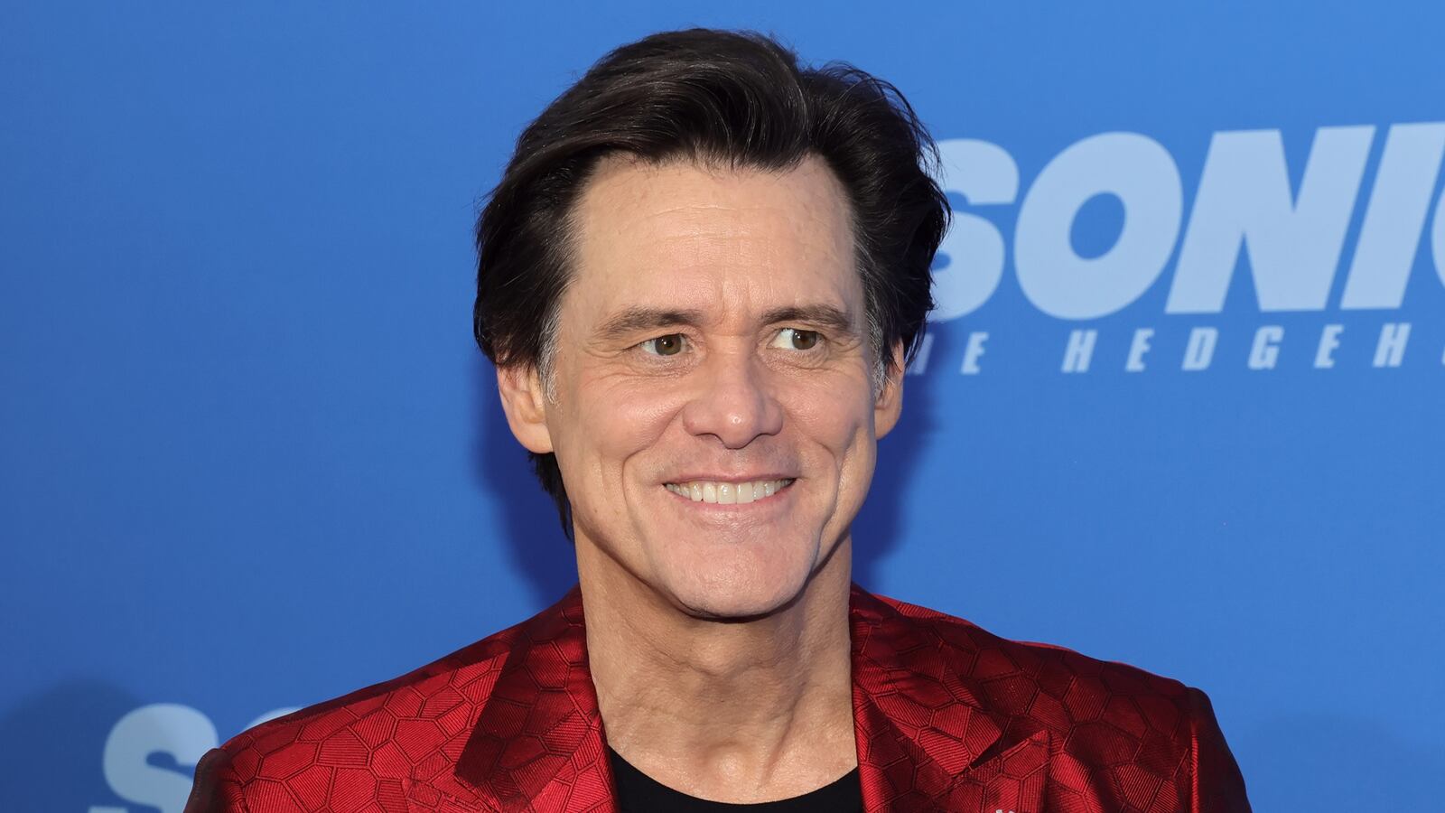 Jim Carrey smiles.