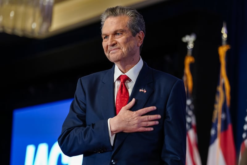 Republican gubernatorial candidate Rick Jackson holds his hand over his heart as he takes the stage at his election night watch party on May 19, 2026 in Atlanta, Georgia after it became clear he would advance to the runoff against Lieutenant Governor Burt Jones.