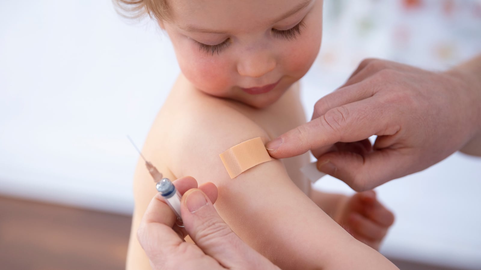 Bonn, Germany - February 19: In this photo illustration a child was getting a vaccination on February 19, 2021 in Bonn, Germany. (Photo by Ute Grabowsky/Photothek via Getty Images)