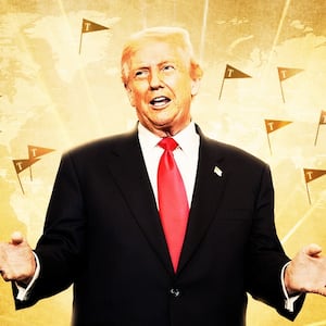 Donald Trump in front of a map with tiny Trump flags.