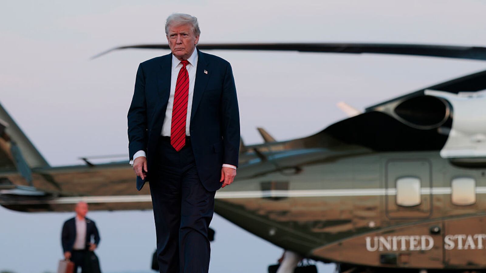 U.S. President Donald Trump walks towards reporters from Marine One at at the Lehigh Valley International Airport on August 03, 2025 in Allentown, Pennsylvania. Trump spent the weekend at his property in Bedminster, New Jersey.
