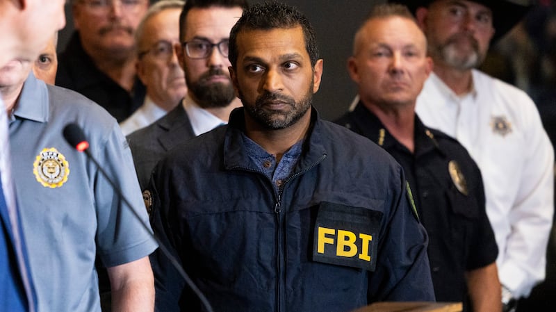 FBI director Kash Patel listens as Utah Department of Public Safety commissioner Beau Mason, left, speaks during a press conference at Utah Valley University