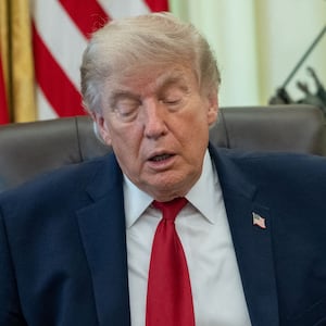 Environmental Protection Agency (EPA) Administrator Lee Zeldin hands President Donald Trump an executive order on vehicle repairs in the Oval Office at the White House in Washington, D.C., U.S., June 29, 2026.