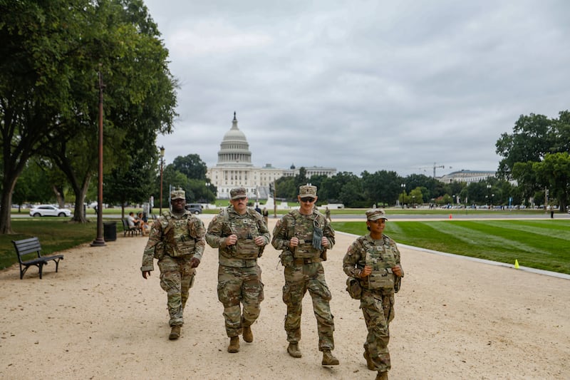 National Guard troops patrol around Union Station and the National Mall as part of ongoing security measures in the U.S. capital Washington, D.C. on August 21, 2025.