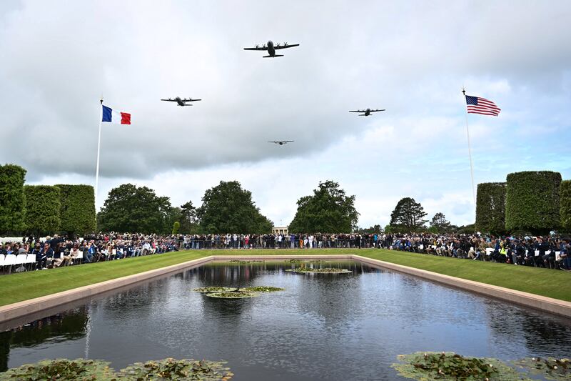 Military aircraft perform a flyover during a memorial ceremony held as part of the 81st anniversary of the World War II D-Day Allied landings in Normandy.