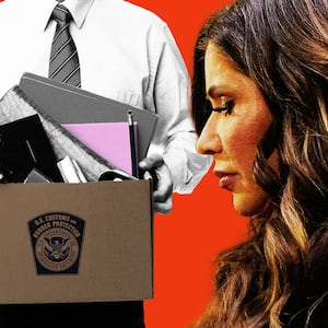 Kristi Noem in front of a man holding a box of items from his office after being fired