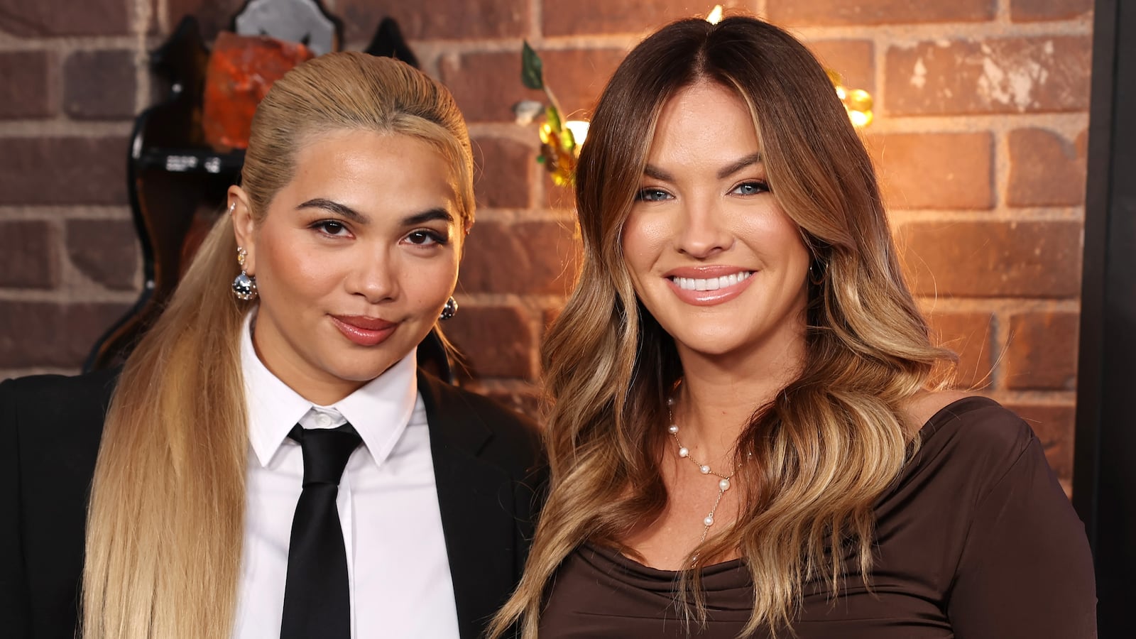 (L-R) Hayley Kiyoko and Becca Tilley attend the World Premiere of Disney's "Wizards Beyond Waverly Place" at El Capitan Theatre on October 28, 2024 in Los Angeles, California.