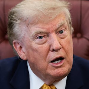 U.S. President Donald Trump answers questions from the media after signing an executive order establishing the President's Military Spouse Commission to be chaired by Jennifer Rauchet, wife of Secretary of Defense Pete Hegseth, in the Oval Office at the White House in Washington, D.C., U.S., August 3, 2026. REUTERS/Evelyn Hockstein