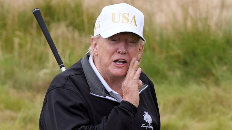 U.S. President Donald Trump gestures as he starts playing golf after the opening ceremony for Trump International Golf Links near Aberdeen, Scotland, Britain July 29, 2025.  Alastair Grant/Pool via REUTERS