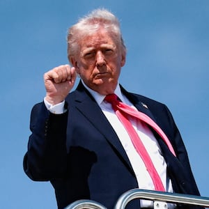 U.S. President Donald Trump makes a fist as he boards Air Force One for his trip to Las Vegas, Nevada, as he departs Joint Base Andrews, Maryland, U.S., on the day he announced that Israeli and Lebanese leaders had agreed to begin a 10-day ceasefire, April 16, 2026. REUTERS/Evan Vucci