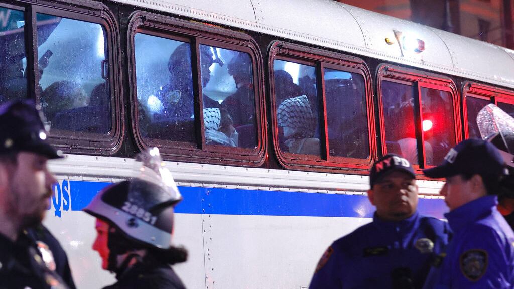 NYPD officers transport arrested students in a bus as they evict a building that had been barricaded by pro-Palestinian student protesters at Columbia University.