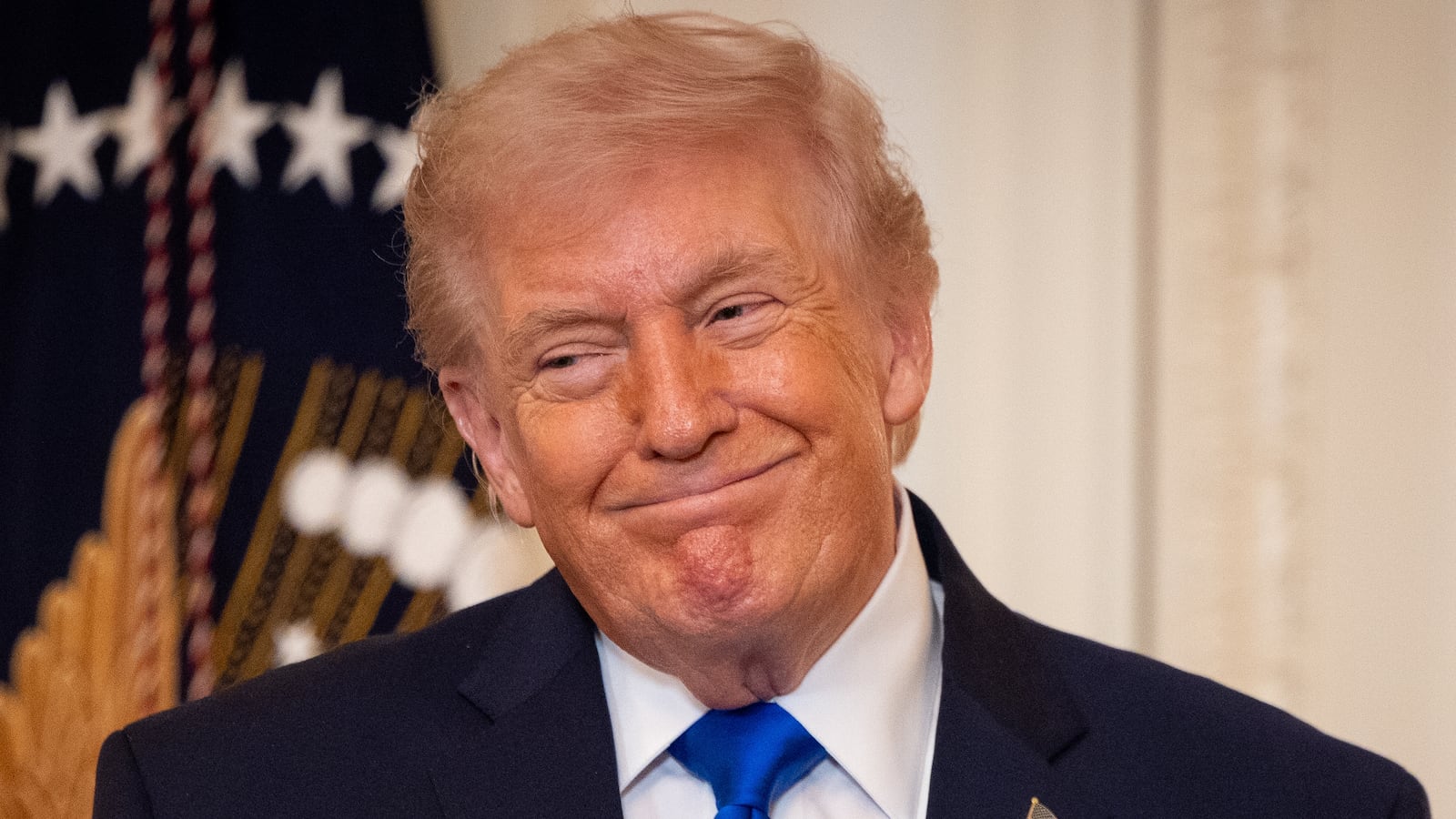 WASHINGTON, DC - FEBRUARY 23: President Donald Trump listens as Laura Wilkerson speaks during the Angel Families Remembrance Ceremony in the East Room of the White House in Washington, DC on February 23, 2026. (Photo by Nathan Posner/Anadolu via Getty Images)