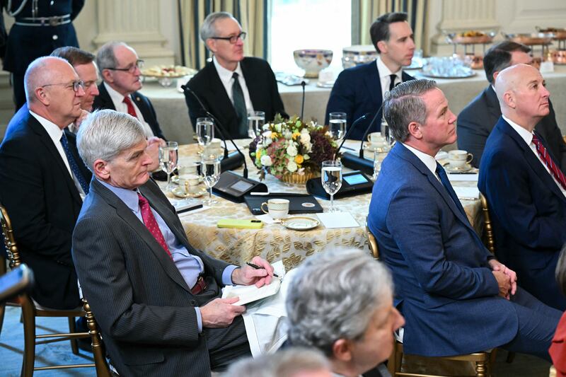 Republican Senators listen as President Donald Trump speaks during a breakfast meeting in the State Dining Room of the White House on November 5, 2025.