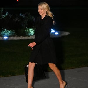 Executive assistant to US President Donald Trump, Natalie Harp, walks to the White House from Marine One on the South Lawn in Washington, DC, on October 3, 2026. President Trump is returning from Ohio where he spoke at a midterm campaign rally. (Photo by Alex WROBLEWSKI / AFP via Getty Images)