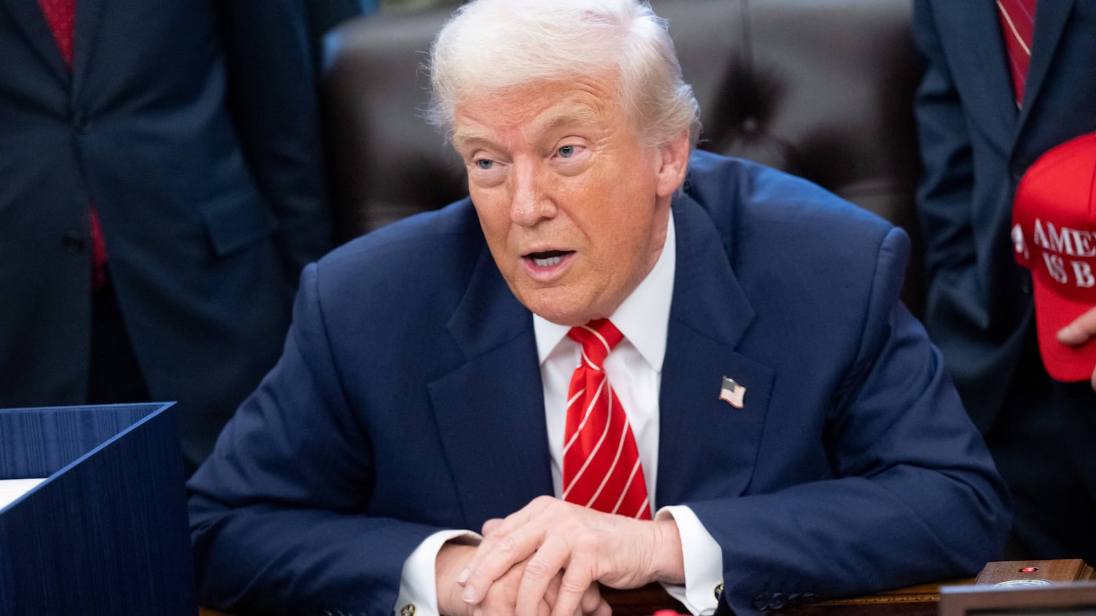President Donald Trump speaks with the media after signing a funding bill to end a partial government shutdown in the Oval Office of the White House in Washington, DC, February 3, 2026.