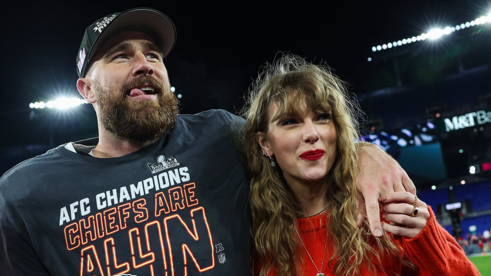 Travis Kelce #87 of the Kansas City Chiefs (L) celebrates with Taylor Swift after defeating the Baltimore Ravens in the AFC Championship Game at M&T Bank Stadium on January 28, 2024 in Baltimore, Maryland.