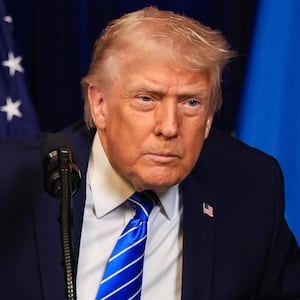 U.S. President Donald Trump listens to a question from a reporter during a press conference with Ukrainian President Volodymyr Zelensky following their meeting at Trump’s Mar-a-Lago club on December 28, 2025 in Palm Beach, Florida.