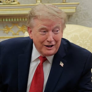 U.S. President Donald Trump hosts 16-year-old lifeguard Ryder Williams, who saved a child off the coast of Santa Cruz, California, last month, and Nathaniel Rai, the child saved by Williams, in the Oval Office at the White House in Washington, D.C., U.S., August 17, 2026.