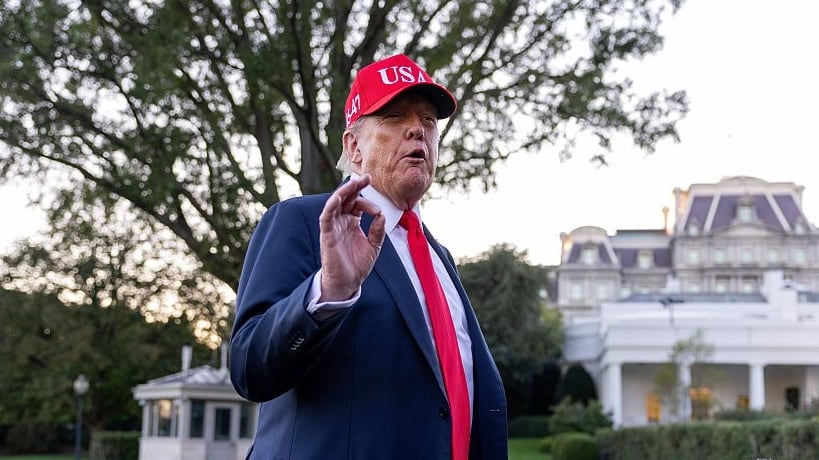 U.S. President Donald Trump talks to the media after walking off Marine One on the South Lawn of the White House on October 05, 2025 in Washington, DC. Trump was returning from a celebration of the Navy’s 250th anniversary in Norfolk, Virginia. (Photo by Tasos Katopodis/Getty Images)