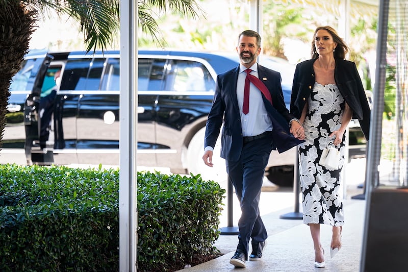 Donald Trump Jr., executive vice president of development and acquisitions for Trump Organization Inc. (L) and his fiancee Bettina Anderson, arrive at Mar-a-Lago on February 1, 2026 in Palm Beach, Florida.