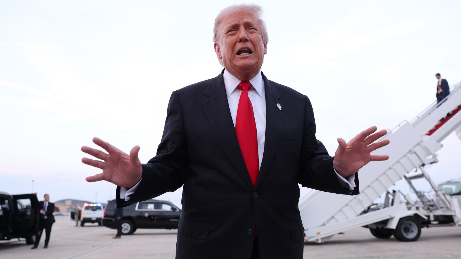 President Donald Trump gives brief remarks to members of the press after exiting Air Force One on November 9, 2025 at Joint Base Andrews, Maryland.