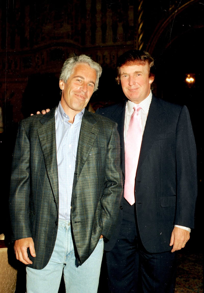 Jeffrey Epstein (left) and Donald Trump as they pose together at the Mar-a-Lago estate, Palm Beach, Florida on February 22, 1997.