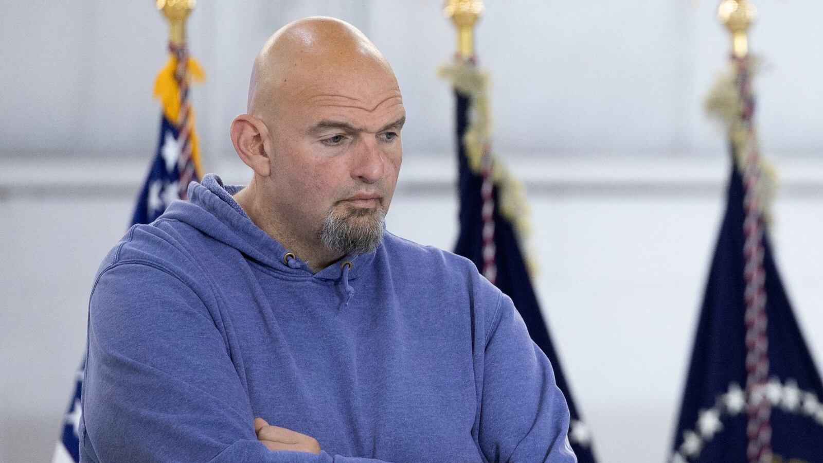 U.S. Senator John Fetterman (D-PA) listens as U.S. President Joe Biden addresses the Interstate 95 bridge collapse