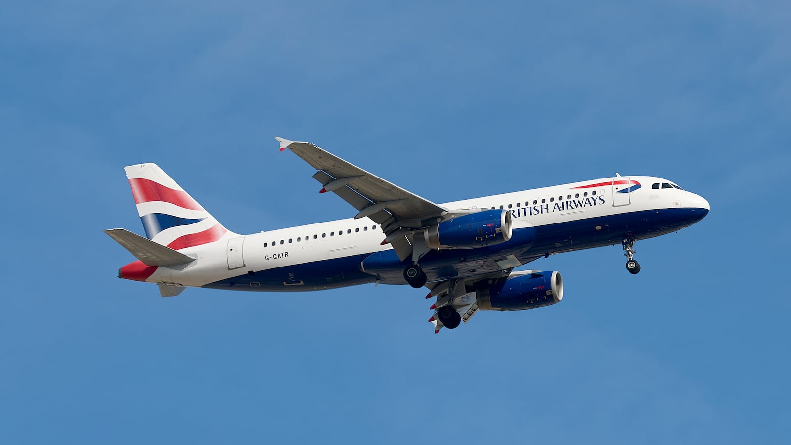 A G-GATR British Airways Airbus A320-200 flies over the match venue during the UEFA European Under-19 Championship qualifying round group 13 soccer match between Czechia and Malta at the Centenary Stadium in Ta Qali, Malta, on November 15, 2025. (Photo by Domenic Aquilina/NurPhoto via Getty Images)