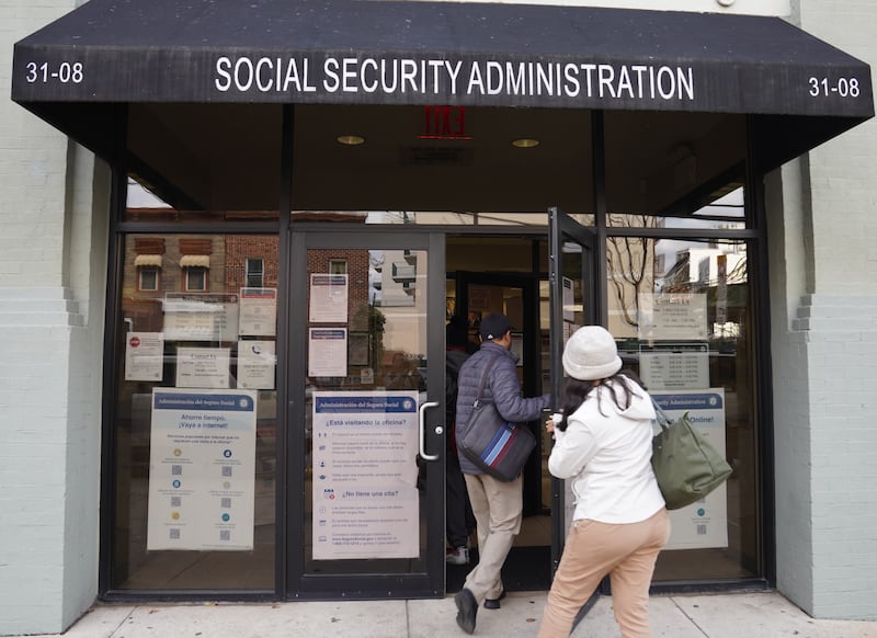 People step into an office of the Social Security Administration in New York