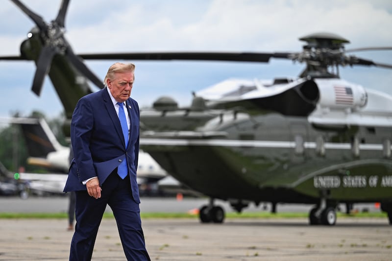 U.S. President Donald Trump walks after disembarking Marine One at Morristown Municipal Airport in Morristown, New Jersey, U.S., August 2, 2026.