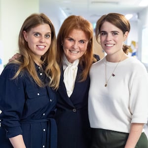 Sarah, Duchess of York with her daughters Princess Beatrice and Princess Eugenie during a visit to the Teenage Cancer Trust unit at University College Hospital, London. Picture date: Wednesday April 23, 2025. (Photo by Aaron Chown/PA Images via Getty Images)