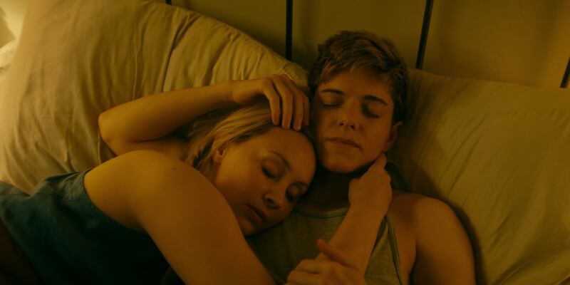 Sarah Gadon as Laura Redman and Mae Martin as Alex Dempsey