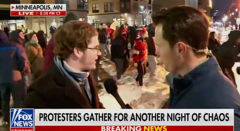 Garrett Tenney interviewing a Minneapolis anti-ICE protester on January 9.