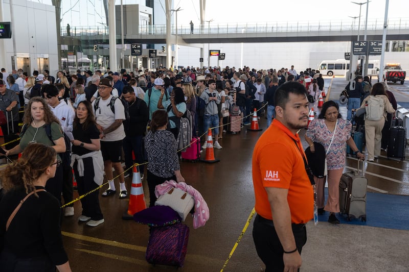 Travelers wait in line outside of Terminal E at George Bush Intercontinental Airport on March 27, 2026 in Houston, Texas. The Senate unanimously approved funding for the Department of Homeland Security, excluding money for immigration enforcement and deportation operations, but House Republicans rejected it Friday.