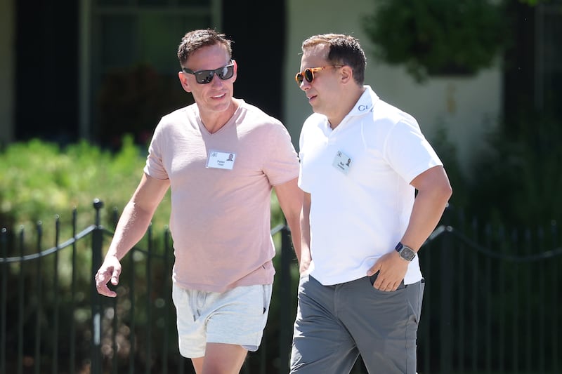 SUN VALLEY, IDAHO - JULY 09: (L-R) Co-founder PayPal Peter Thiel and his husband Matt Danzeisen attend the Allen & Company Sun Valley Conference at the Sun Valley Lodge on July 9, 2026 in Sun Valley, Idaho. Every year, some of the world's wealthiest and most powerful figures from the media, finance, technology, and political spheres converge at the Sun Valley Resort for the exclusive week-long conference hosted by boutique investment bank Allen & Co. (Photo by Kevin Dietsch/Getty Images)