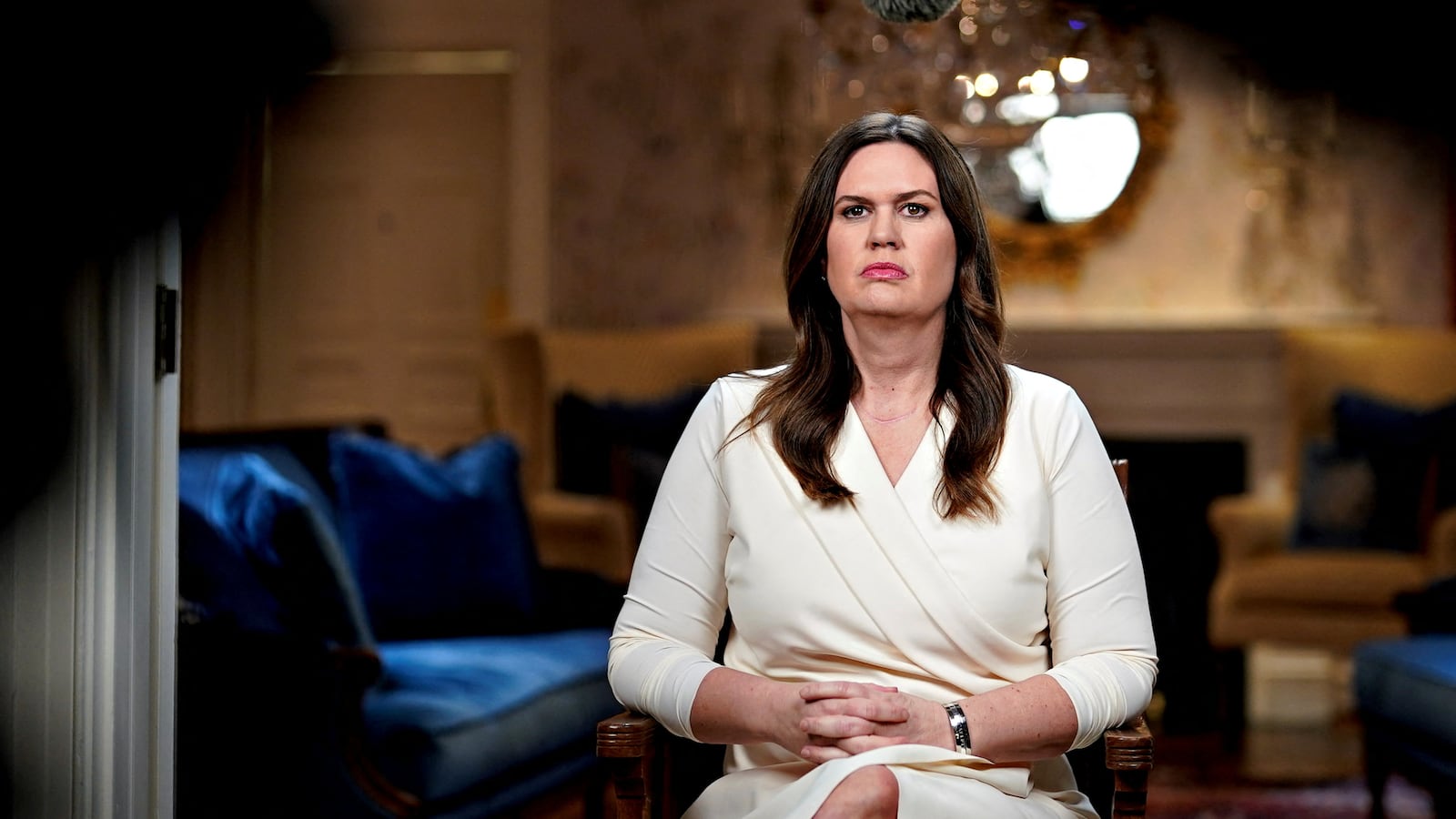 Arkansas Gov. Sarah Huckabee Sanders sitting down.