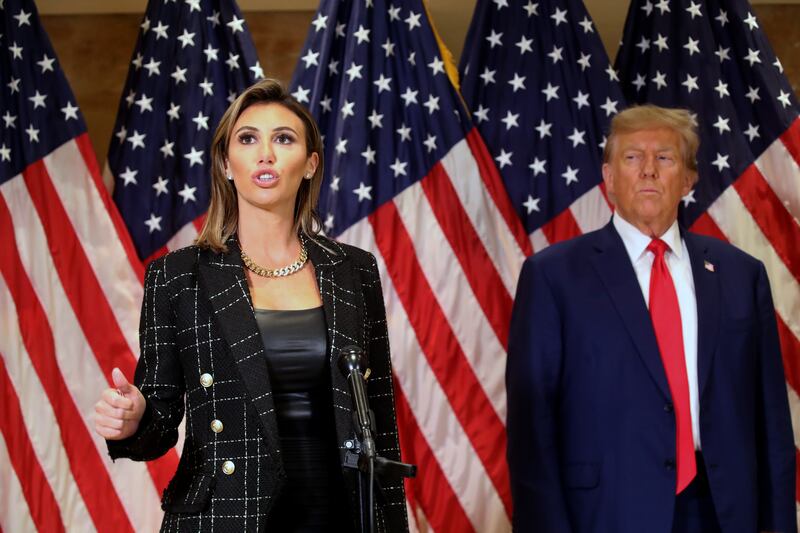 Donald Trump stands with his lawyer Alina Habba as she speaks to the media in New York in January 2024.