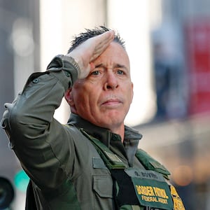 US Customs and Border Patrol Commander Gregory Bovino (C) leaves federal court at Dirksen Federal Building after his hearing in Chicago, Illinois, on October 28, 2025. Bovino was ordered to appear in federal court for violating a temporary restraining order issued by District Judge Sara Ellis that orders immigration enforcement agents to limit use of tear gas and other crowd-suppression items except when there is an imminent threat. (Photo by KAMIL KRZACZYNSKI / AFP) (Photo by KAMIL KRZACZYNSKI/AFP via Getty Images)
