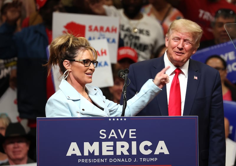 Republican U.S. House candidate former Alaska Gov. Sarah Palin speaks as Donald Trump looks on during a "Save America" rally on July 09, 2022 in Anchorage, Alaska.
