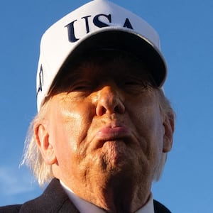 US President Donald Trump speaks to reporters before boarding Air Force One as he departs Joint Base Andrews in Maryland on March 13, 2026. President Trump is heading to Florida to spend the weekend at his Mar-a-Lago resort. (Photo by SAUL LOEB / AFP via Getty Images)