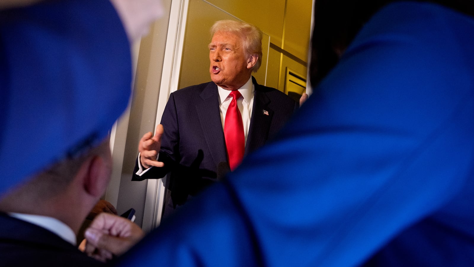 President Donald Trump speaks to members of the media aboard Air Force One on October 30, 2025 in flight. Trump is returning to Washington following a high-stakes meeting with Chinese President Xi Jinping, alongside securing trade deals with ASEAN, Japanese and South Korean partners on his week-long Asian tour.