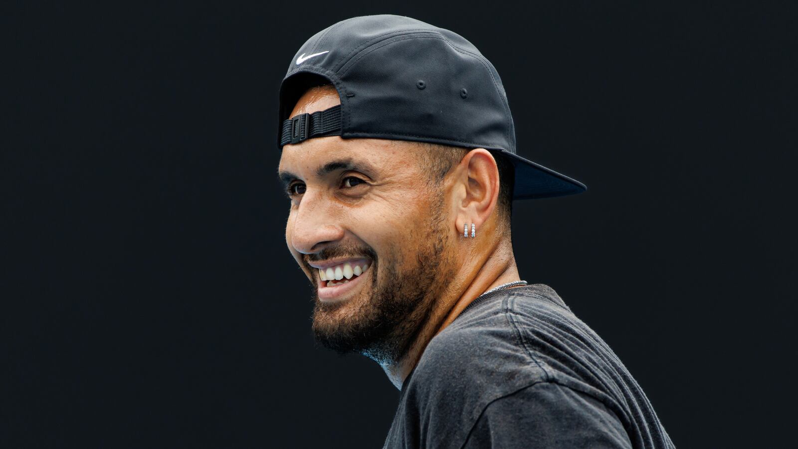 Nick Kyrgios of Australia laughs during a practice session on court 16 at Melbourne Park in Melbourne, Victoria, Australia, Jan. 15, 2023.