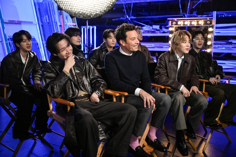 Members of the group BTS with host Jimmy Fallon during a "Fan Surprise" on Wednesday, March 25, 2026.