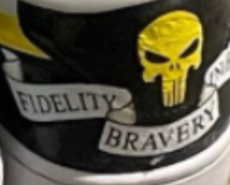 A close-up of the FBI motto on Patel's sneakers.