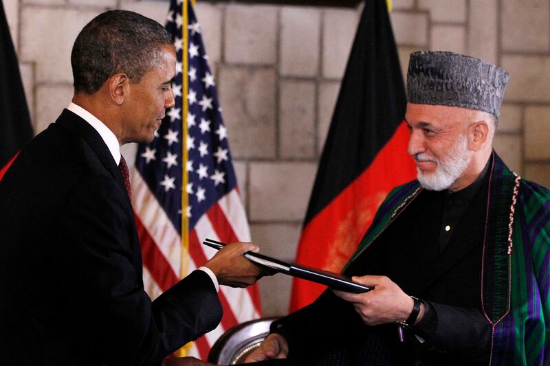 articles/2012/05/02/a-strategist-for-the-war-in-afghanistan-says-it-s-time-to-pull-back/lake-obama-carstens-afghan-embed_jdfjwr